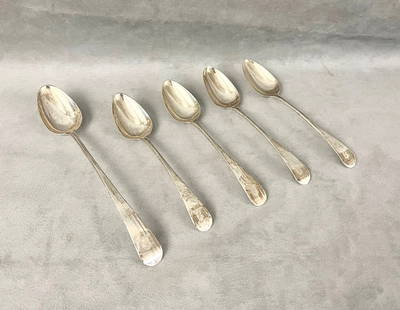 FIVE GEORGE III SILVER SPOONS MADE BY HESTER BATEMAN, - Platter spoon, L: 11 1/4 in. Wt. 11 troy oz.: FIVE GEORGE III SILVER SPOONS MADE BY HESTER BATEMAN. Including platter spoon, 1785-6; and set four tablespoons, 1786-7. Down-turned oval terminals, the platter spoon engraved with armorial device of