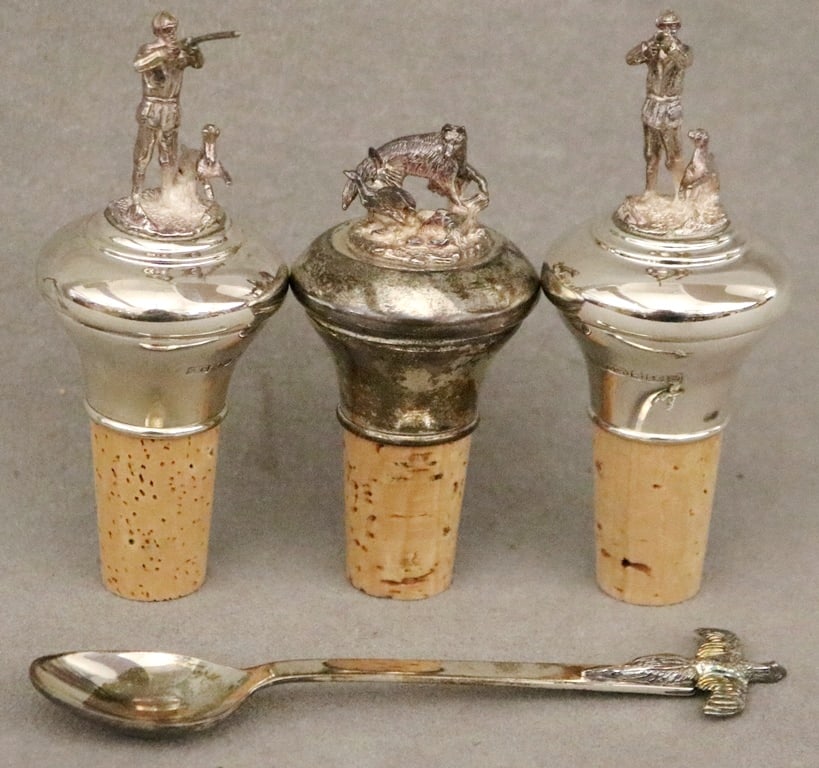 SET OF THREE ENGLISH STERLING SILVER WINE BOTTLE STOPPERS, AND A SILVER SPOON BY LINKS OF LONDON,: SET OF THREE ENGLISH STERLING SILVER WINE BOTTLE STOPPERS, AND A SILVER SPOON BY LINKS OF LONDON. Stoppers, hallmarked Birmingham, by "AJP" have fully sculpted hunting/shooting related figural finials