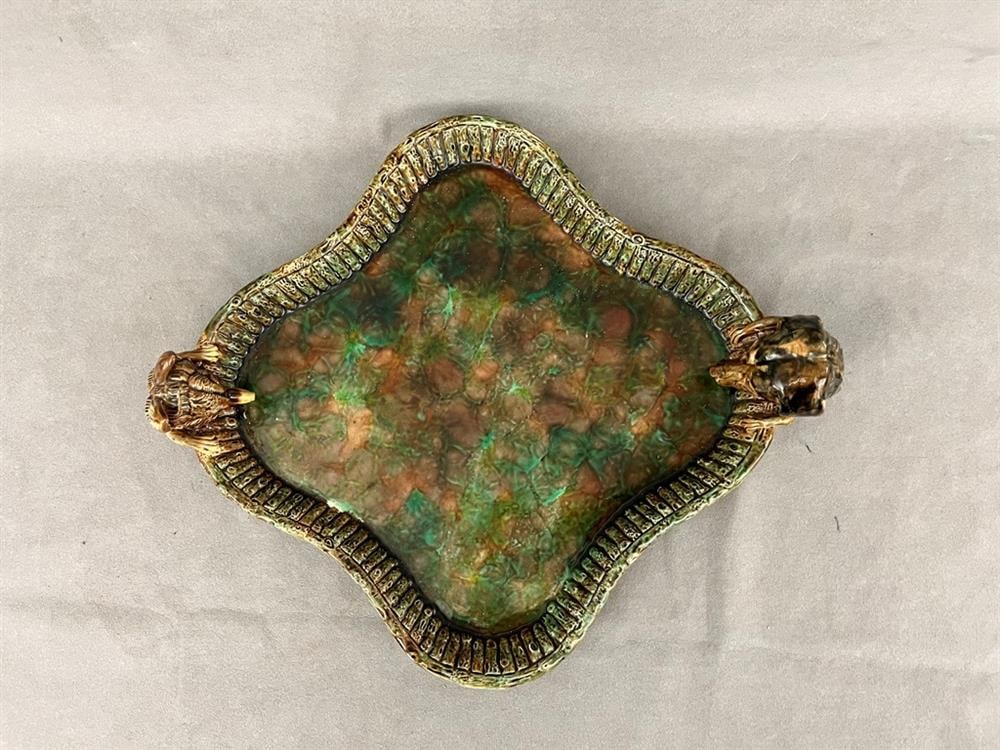 19TH CENTURY ENGLISH MAJOLICA GREEN AND BROWN IRIDESCENT GLAZED HUNTING-THEME SERVING PLATE, - L:: 19TH CENTURY ENGLISH MAJOLICA GREEN AND BROWN IRIDESCENT GLAZED HUNTING-THEME SERVING PLATE. Serpentine square modeled with head of hunting hound opposing fox head. - L: 15".