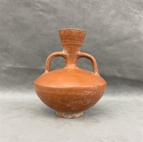 ROMAN REDWARE DOUBLE HANDLED PITCHER OR FLAGON, ROMAN IMPERIAL PERIOD, circa 1st to 3rd century AD.