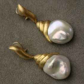 PAIR SIGNED YVEL 18K (750) FLORENTINE TEXTURED AND BAROQUE PEARL DANGLE EARRINGS.
