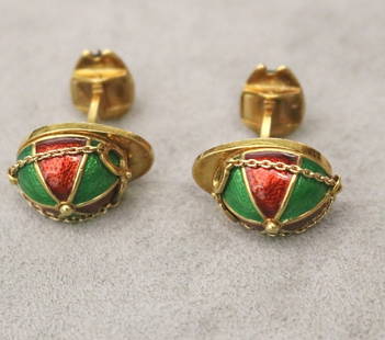 PAIR 18K YELLOW GOLD AND RED AND GREEN ENAMEL JOCKEY CAP DESIGN CUFFLINKS. - Gross wt: 16 dwt.: PAIR 18K YELLOW GOLD AND RED AND GREEN ENAMEL JOCKEY CAP DESIGN CUFFLINKS. Cap fashioned with goggles on chain opposed by yellow gold and enamel horseshoe; logo-signed. - Gross wt: 16 dwt.