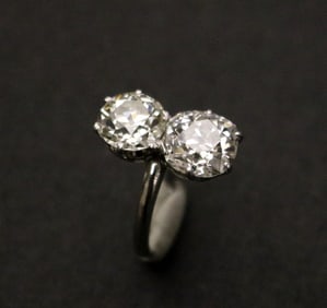 PLATINUM AND DIAMOND TWO-STONE RING.