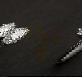 PLATINUM AND DIAMOND TWO-STONE RING.