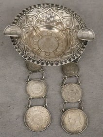 SOUTH AMERICAN SILVER REPOUSSE ASHTRAY IMPRESSED WITH BRAZILIAN COINS AND SUSPENDING TWO CHAINS OF