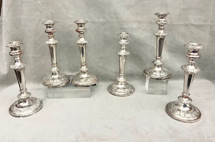 SET OF SIX LATE 19TH CENTURY SILVER-ON-COPPER CANDLESTICKS.