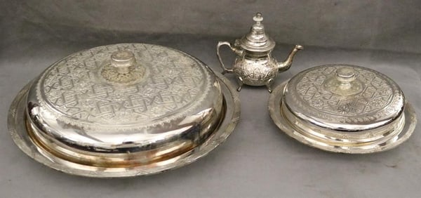 SET SEVEN MOROCCAN SILVER-PLATED LIFT-COVER CIRCULAR SERVING DISHES. signed (in Arabic) Mohamad al