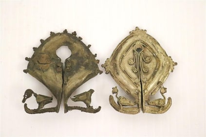 TWO INDONESIAN SUMBA ISLAND MAMULI EAR ORNAMENTS, Early-to-mid 20th century. - Each one