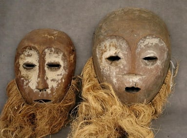 CONGOLESE BWAMI SOCIETY LEGA MASKS, - Height: Larger mask: 10 inches (excluding raffia beard).