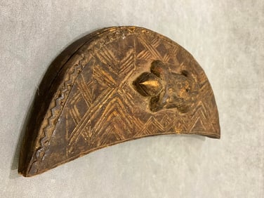CONGOLESE KUBA TUKULA DECORATED CRESCENT-SHAPED BOX. - Height approximately: 16 inches.