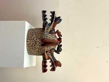IVORY COAST SENUFO KPONIUGO "FIRESPITTER" HELMET MASK. - Height: 14 inches, Width: 27 inches.