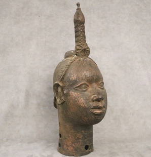 NIGERIAN BENIN BRONZE HEAD OF A CROWNED IFE ONI KING. - Height: 21.5 inches.: NIGERIAN BENIN BRONZE HEAD OF A CROWNED IFE ONI KING. Patinated bronze head of an IFE King with intricate details. The IFE region was formerly the religious and royal center of the YORUBA people. It