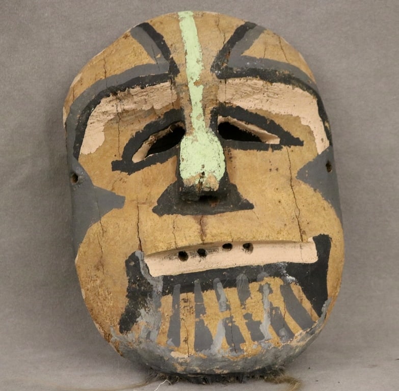AMERICAN OR MEXICAN UNIDENTIFIED MASK, - Height 10 inches.: AMERICAN OR MEXICAN UNIDENTIFIED MASK. Hand-carved from wood and featuring painted details mask, including a broad forehead, aquiline nose, gaping mouth with a painted mustache, and deep facial wrink