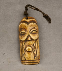 CONGOLESE BEMBE BONE AMULET. - Height: 3.25 inches.