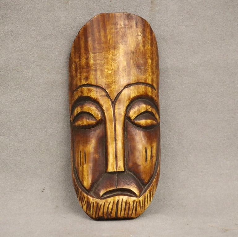 CONGOLESE CARVED BONE PENDANT. - Height: 7 inches.: CONGOLESE CARVED BONE PENDANT. - Height: 7 inches.