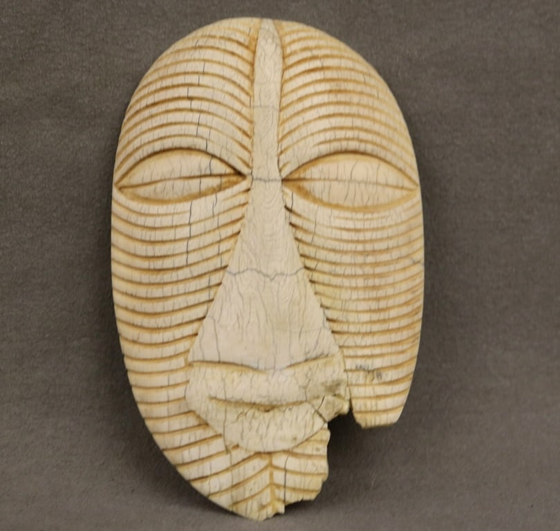 CONGOLESE LUBA KIFWEBE BONE MASK. - Height: 5.25 inches.: CONGOLESE LUBA KIFWEBE BONE MASK. Kifwebe mask associated with the Luba people, as well as the Songye and Kalebwe communities, particularly in the Democratic Republic of Congo. Kifwebe masks are know