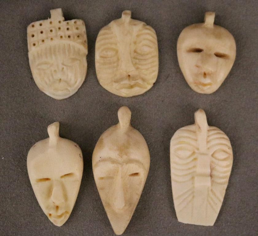 CONGOLESE SELECTION OF CARVED PENDANTS. - Height: (approx.) 2 inches. (1 of 19)