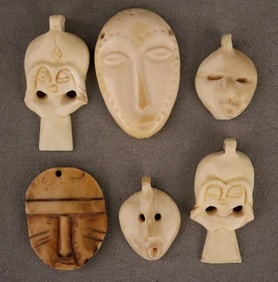 CONGOLESE SELECTION OF CARVED PENDANTS. - Height: (approx.) 2 inches.