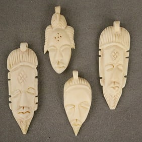 CONGOLESE SELECTION OF CARVED PENDANTS. - Height: (approx.) 3 inches.