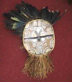 CONGOLESE TEKE-TSAYE KIDUMU MASK, - height 38 inches (including raffia and feathers).