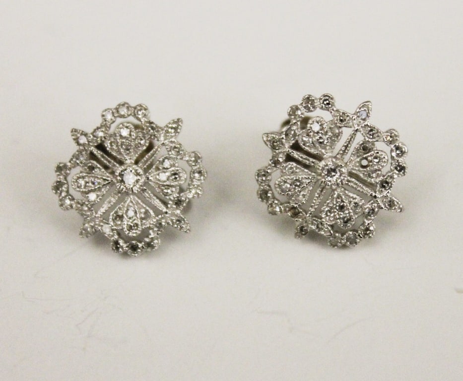 PAIR 14K WHITE GOLD AND DIAMOND OPENWORK, SHAPED SQUARE EARRINGS, - 5/8 in. square.: PAIR 14K WHITE GOLD AND DIAMOND OPENWORK, SHAPED SQUARE EARRINGS. Total of 80 round diamonds, screw backs. - 5/8 in. square.