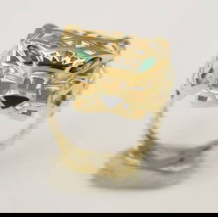 18K BRIGHT-POLISHED YELLOW GOLD OPENWORK, GEOMETRIC PANTHER HEAD DESIGN RING, - Ring size: 7. Gross: 18K BRIGHT-POLISHED YELLOW GOLD OPENWORK, GEOMETRIC PANTHER HEAD DESIGN RING.  Green lozenge shape eyes; triangular black onyx nose - Ring size: 7. Gross wt. 3 dwt.