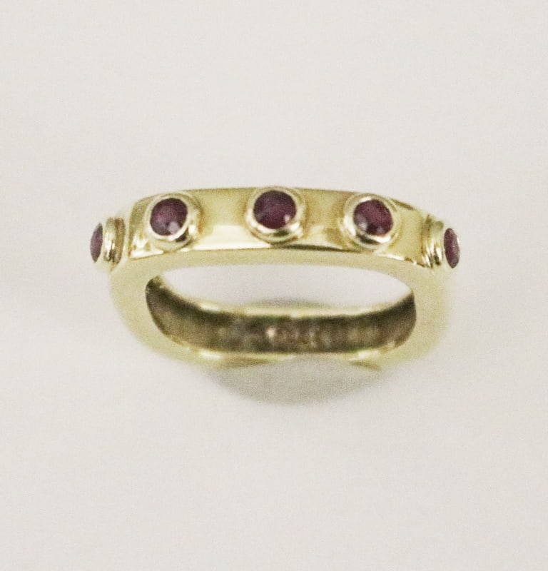 14K YELLOW GOLD AND RUBY CONTEMPORARY SQUARED BAND. - Ring size: 5. W: 1/8". Gross wt: 3 dwt. (1 of 1)