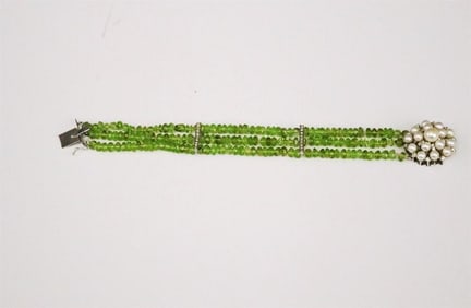 TRIPLE-STAND PERIDOT CHUNK BEAD BRACELET WITH 14K WHITE GOLD CULTURED PEARL AND DIAMOND CLASP.