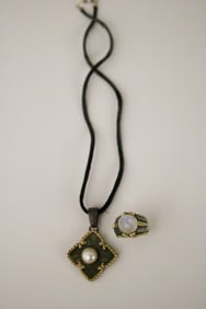 SIGNED MAZ YELLOW GOLD AND STERLING SILVER DOME RING WITH SIMILAR PENDANT ON CORD.