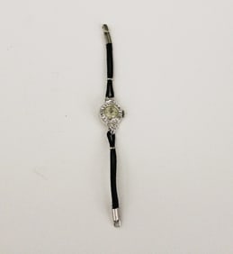 LADY'S 14K WHITE GOLD AND DIAMOND EVENING WATCH, mid 20th century. - Gross wt. 6 dwt.