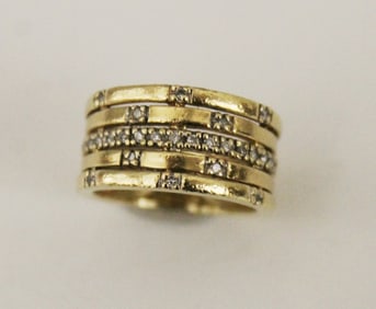14K YELLOW GOLD AND DIAMOND BAND, - W: 3/8 in. Ring size: 4 Gross wt. 4 dwt.