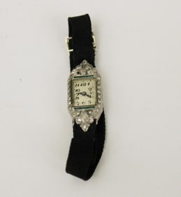 LADY'S ART DECO PLATINUM DIAMOND AND SYNTHETIC EMERALD EVENING WATCH,