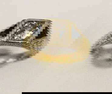 EDWARDIAN YELLOW GOLD DIAMOND AND BLACK ONYX RING. - Ring size: 8. Gross wt: 5 dwt.: EDWARDIAN YELLOW GOLD DIAMOND AND BLACK ONYX RING.  Old european cut round diamond weighing approx .75 ct. centered in platinum-on-yellow gold square box mount flanked by two triangular black onyx acc