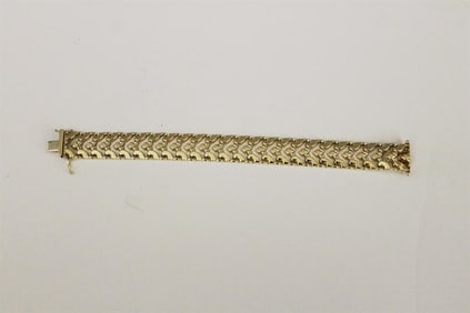 ITALIAN 14K BRIGHT-POLISHED GOLD OPENWORK FLEXIBLE STRAP BRACELET. - L: 7 1/8 in.; W: 5/8 in. Wt. 9