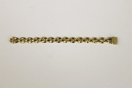 ITALIAN 14K BRIGHT-POLISHED YELLOW GOLD THREE-ROW PANTHER LINK FLEXIBLE STRAP BRACELET. - L: 7 in.