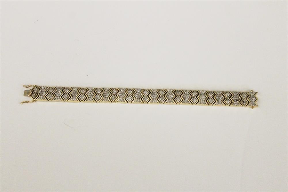 14K YELLOW GOLD AND DIAMOND STRAP BRACELET. - L: 7 1/2 in. W: 1/2 in. Gross wt. 1 oz. 8 dwt. (1 of 3)