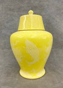 JAPANESE YELLOW PORCELAIN TEMPLE JAR WITH LIFT COVER AND PATE-SUR-PATE TYPE DECORATION. - H: 13 in.: JAPANESE YELLOW PORCELAIN TEMPLE JAR WITH LIFT COVER AND PATE-SUR-PATE TYPE DECORATION.  White aquatic plants and fish - H: 13 in.