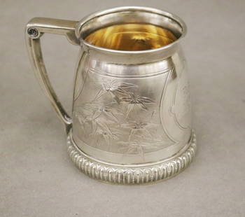 TIFFANY & CO. AESTHETIC MOVEMENT DECORATED STERLNG SILVER CHILD'S CUP. mid 19th century, Panels of: TIFFANY & CO. AESTHETIC MOVEMENT DECORATED STERLNG SILVER CHILD'S CUP. mid 19th century, Panels of low rising floral decoration center engraving "DeF.G./May 13th 1869/From his grandmother" - H: 3 3/4