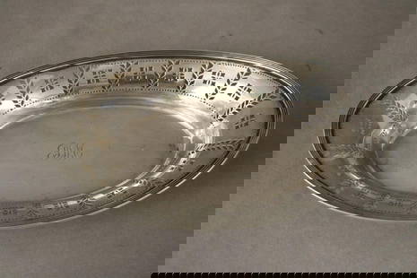 TIFFANY & CO. STERLING SILVER BREAD TRAY, early 20th century. - 6 3/4 in. x 11 1/4 in. Wt. 12.6 troy: TIFFANY & CO. STERLING SILVER BREAD TRAY, early 20th century. Oval with pierced, flaring border, center monogrammed - 6 3/4 in. x 11 1/4 in. Wt. 12.6 troy oz.