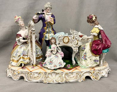 GERMAN POLYCHROMED PORCELAIN FIGURE GROUP, late 19th-early 20th century. - H: 12 3/4 in. L: 17 in.: GERMAN POLYCHROMED PORCELAIN FIGURE GROUP, late 19th-early 20th century. Four musicians in 18th century costume variously playing harpsichord, hard, flute and lute in salon setting. Marked - H: 12 3/4