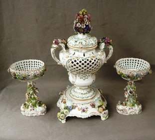 PAIR DRESDEN (CARL THIEME) POLYCHROMED PORCELAIN FIGURAL COMPOTES WITH A SIMILAR LIFT COVER