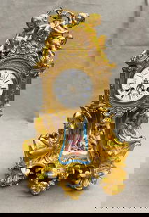 19TH CENTURY XVI STYLE FIGURAL DECORATED ORMOLU MANTEL CLOCK WITH SEVRES PAINTED PORCELAIN PANELS. -: 19TH CENTURY XVI STYLE FIGURAL DECORATED ORMOLU MANTEL CLOCK WITH SEVRES PAINTED PORCELAIN PANELS.  Face signed, Raingo Freres a Paris. Pair Putti surmount circular clock face supported by two seated