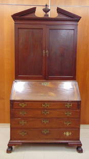 AMERICAN CHIPPENDALE MAHOGANY SECRETARY BOOKCASE. Made New York, circa 1775. - H: 94 in.; W: 44 in.;: AMERICAN CHIPPENDALE MAHOGANY SECRETARY BOOKCASE. Made New York, circa 1775. In two parts. Upper portion has dentiled, broken arch pediment centering finial (19th century) above plain frieze over pair