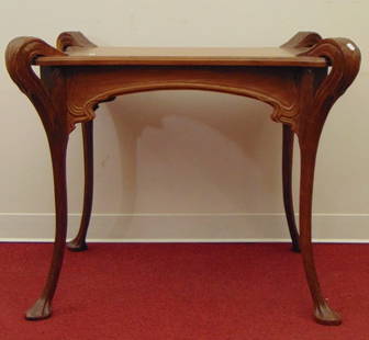 FRENCH ART NOUVEAU CARVED WALNUT TABLE WITH SCROLLING , PROJECTING CORNER ACCENTS AND LILY PAD FEET,: FRENCH ART NOUVEAU CARVED WALNUT TABLE WITH SCROLLING , PROJECTING CORNER ACCENTS AND LILY PAD FEET.  - H: 30 in. Top, 35 in. x 27 1/2 in., overall.