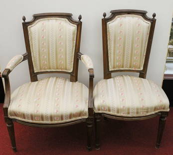 SET SIX LOUIS XVI STYLE CARVED FRUITWOOD AND WALNUT DINING CHAIRS: SET SIX LOUIS XVI STYLE CARVED FRUITWOOD AND WALNUT DINING CHAIRS, 19th century. Including five open-arm chairs and one side chair. Molded frames with aconr finials; muted gold striped fabric upholset