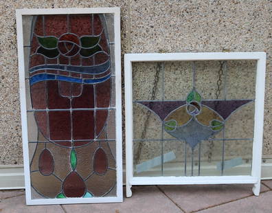 TWO STAINED GLASS WINDOW PANELS WITH ART NOUVEAU MOTIFS, late 19th-early 20th century. - One, 43 1/2: TWO STAINED GLASS WINDOW PANELS WITH ART NOUVEAU MOTIFS, late 19th-early 20th century. Cream color painted frames - One, 43 1/2 in. x 22 in. Other, 33 in. x 31 in.