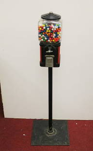 RED AND BLACK METAL, SQUARE-SIDED PEDESTAL-BASE FLOOR MODEL GUMBALL MACHINE, mid 20th century. - H:: RED AND BLACK METAL, SQUARE-SIDED PEDESTAL-BASE FLOOR MODEL GUMBALL MACHINE, mid 20th century. Containing gum balls and chamber of pennies. - H: 45 1/2 in.