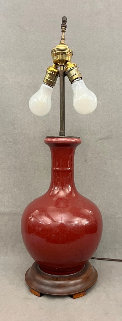 CHINESE SANG-DE-BOEUF GLAZED PORCELAIN BOTTLE VASE MOUNTED AS TWO-LIGHT TABLE LAMP. - Vase portion, (1 of 4)