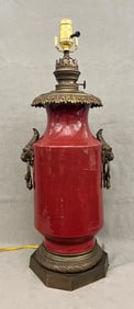 CHINESE SANG-DE-BOEUF GLAZED PORCELAIN CYLINDRICAL VASE MOUNTED AS FLUID LAMP, LATER ELECTRIFIED,