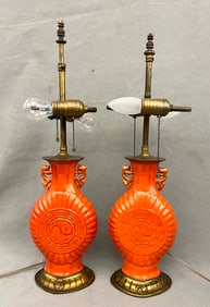 PAIR CHINESE ORANGE GLAZED PORCELAIN TWO-HANDLE VASES DRILLED AND MOUNTED AS TABLE LAMPS.